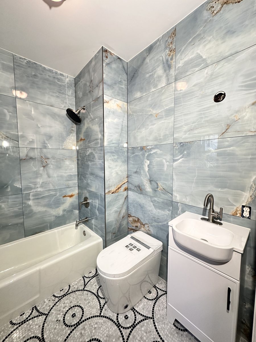 Blue Marble Bathroom with Decorative Mosaic Floor