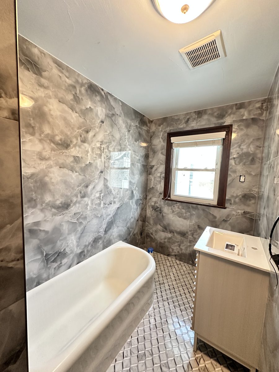 Grey Marble Bathroom with Soaking Tub