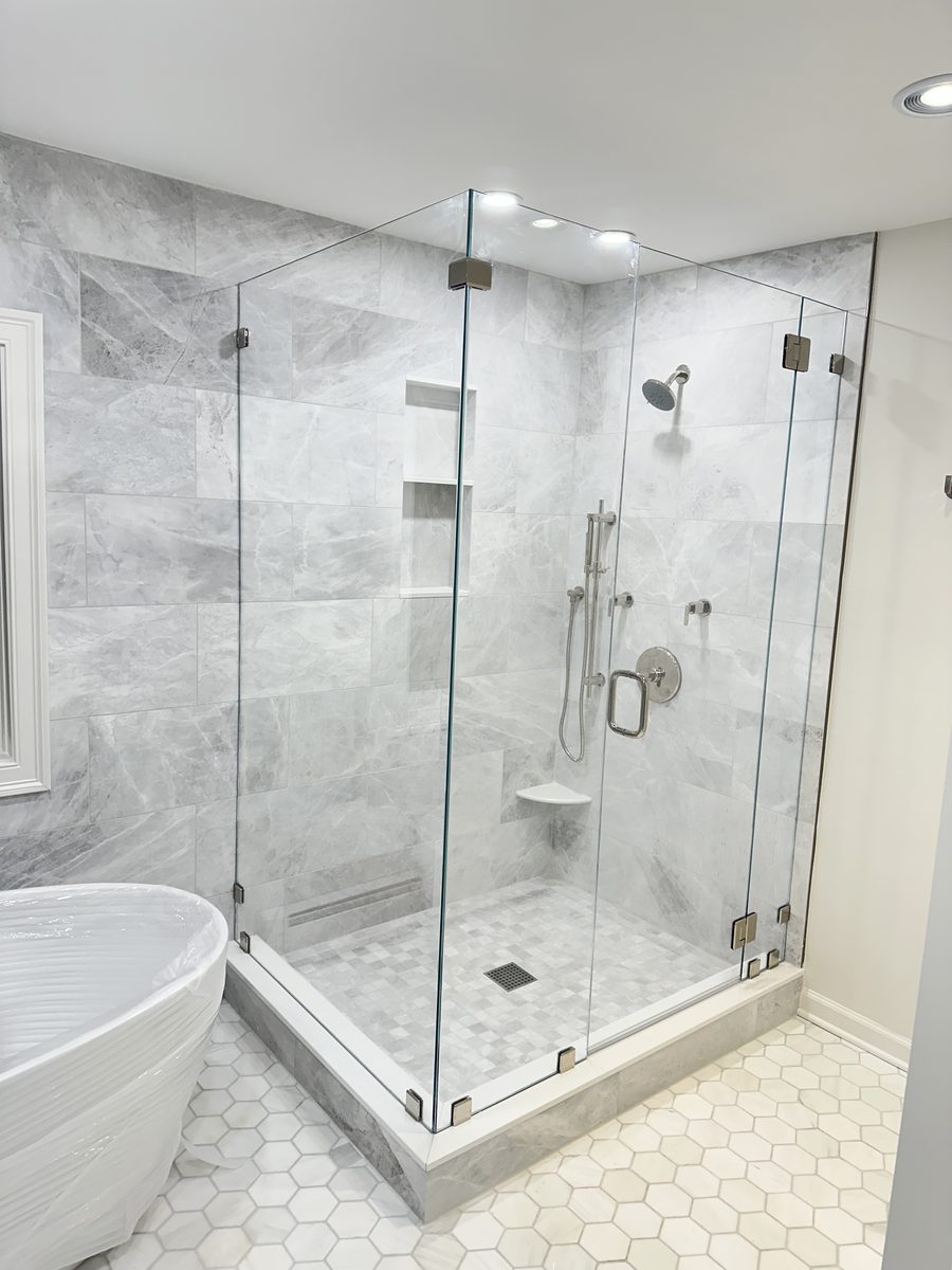 Marble Shower with Frameless Glass Enclosure