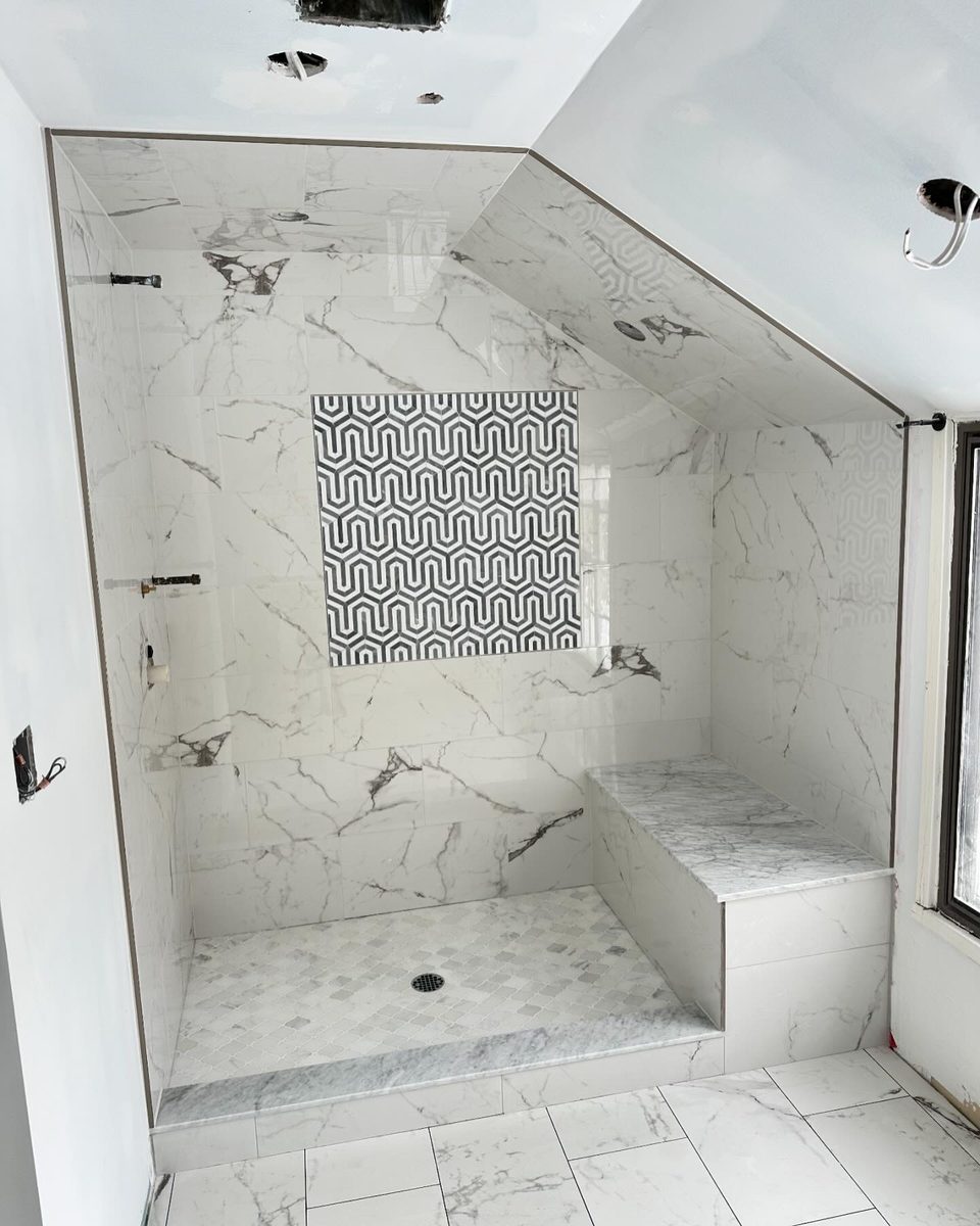 Marble Shower with Geometric Mosaic Niche