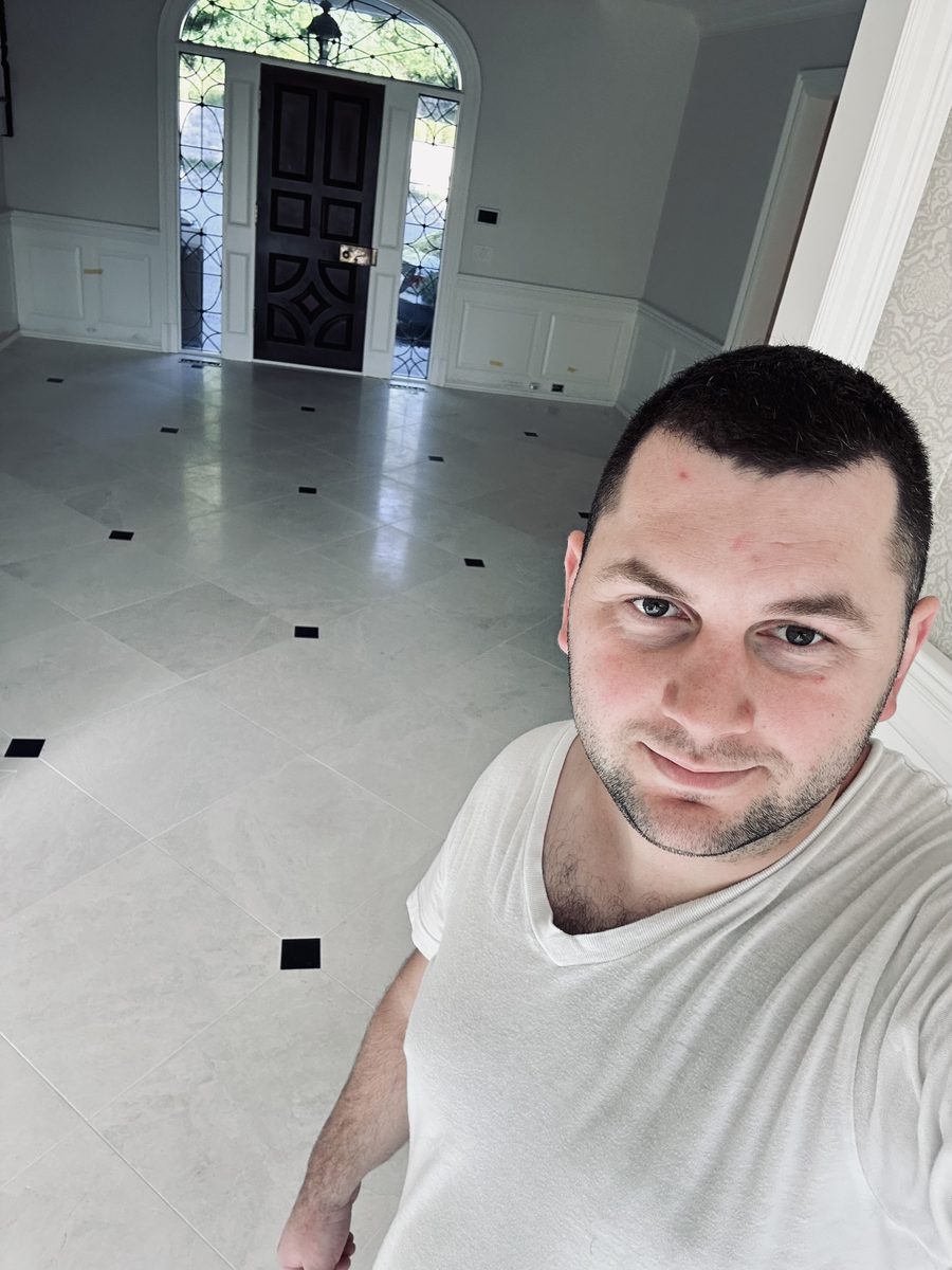 Tile Installer at a Marble Foyer Project